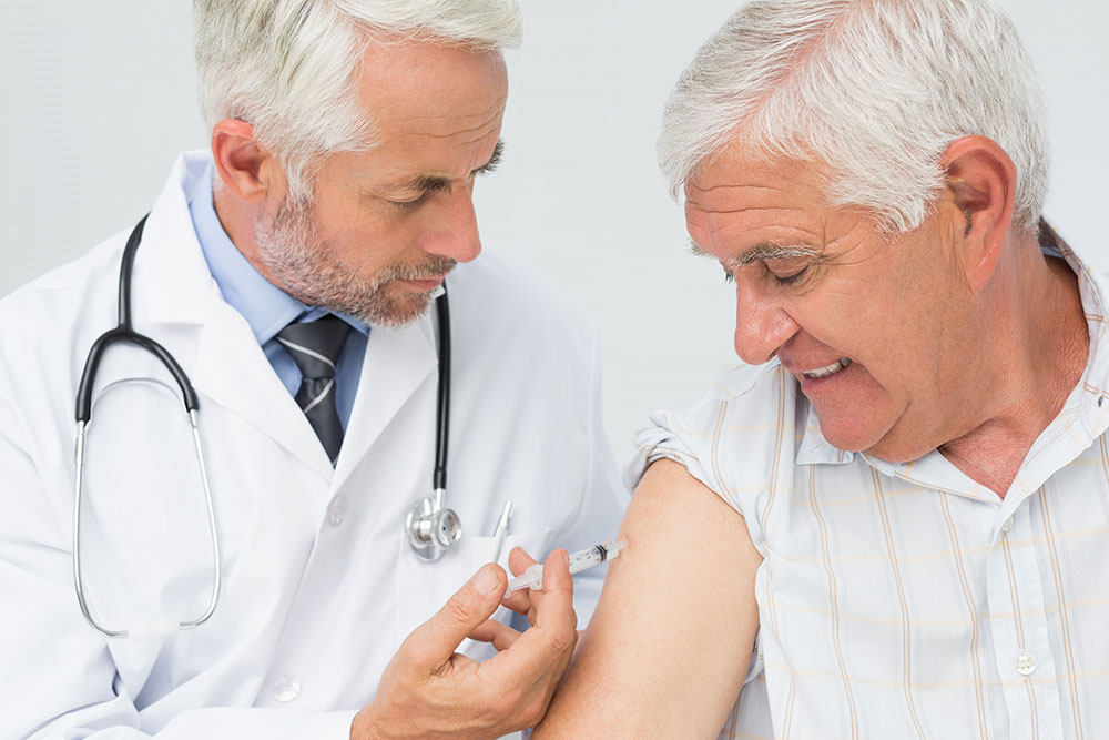 Buy Testosterone Injections a Grey Haired Man Receives an Injection