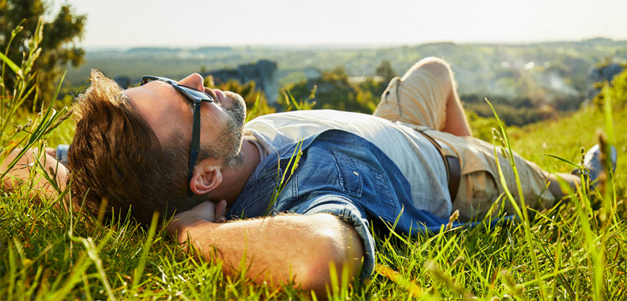 Sermorelin Acetate Cost Man Lying on the Grass